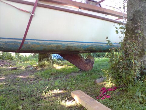 Picture of my boat hanging in the air with the keel being removed through the slot underneath.